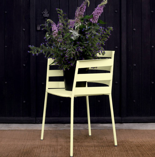 Fermob RYTHMIC outdoor armchair with colorful woven seat and metal frame, perfect for garden or patio seating.