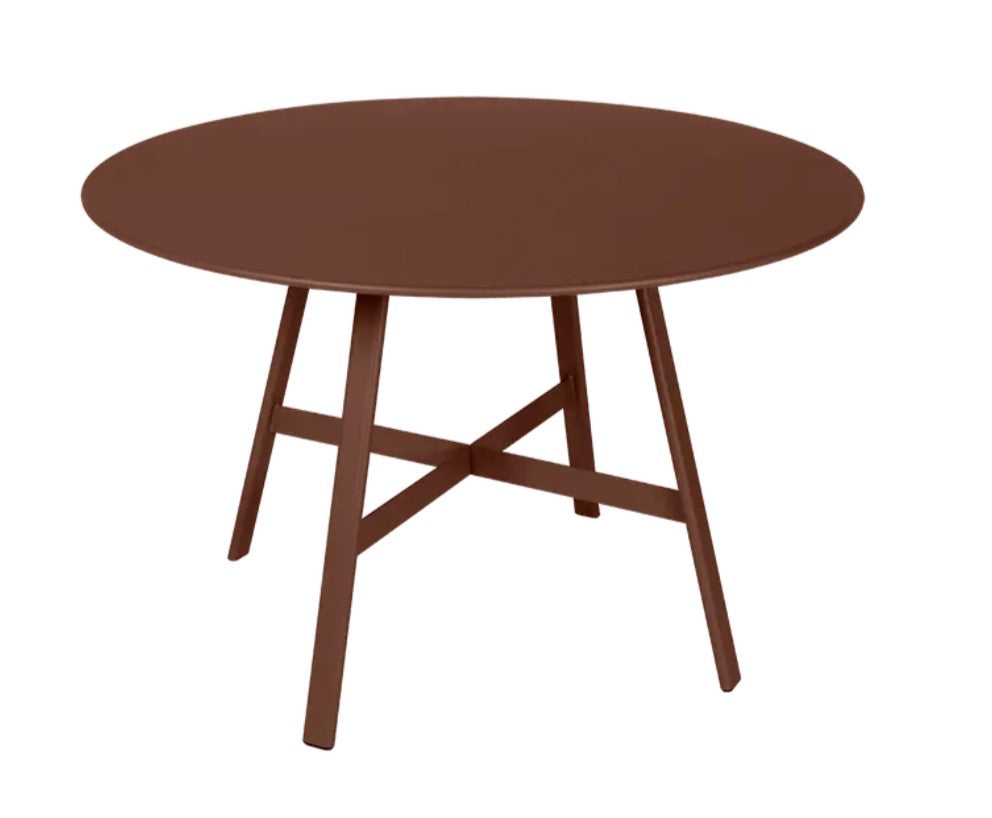 Dark red Fermob SO'O Oval Oak Table Ø117 with sleek wooden surface and modern design.