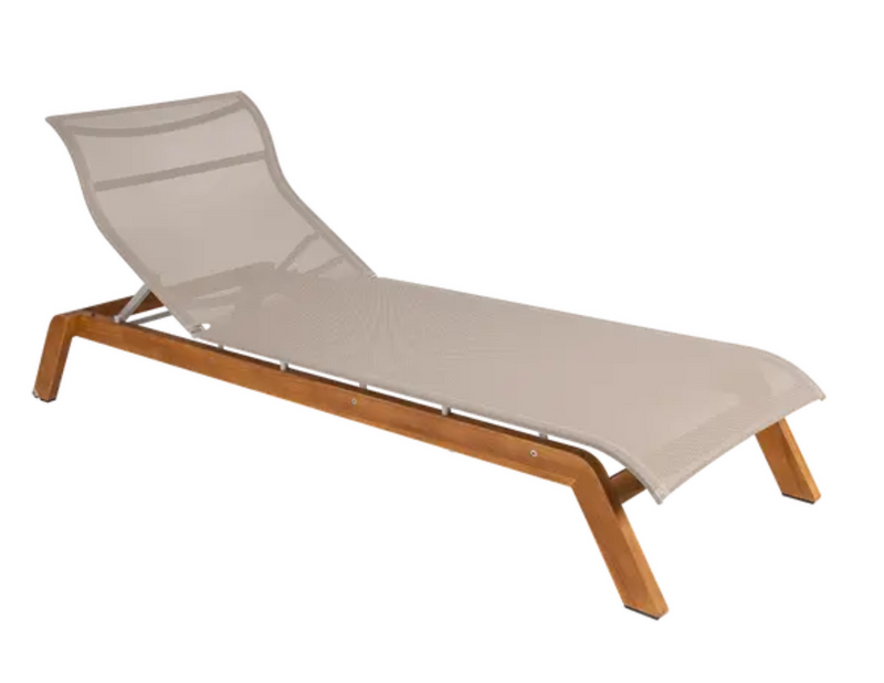Load image into Gallery viewer, Fermob MAUI teak sunlounger with sand-colored Batyline fabric and teak base, outdoor furniture for relaxing in the sun.
