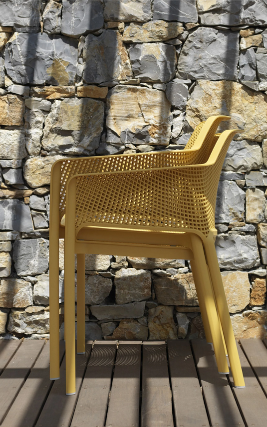 Yellow Nardi Net outdoor chair with a woven seat and backrest, featuring a sleek, modern design for outdoor furniture.