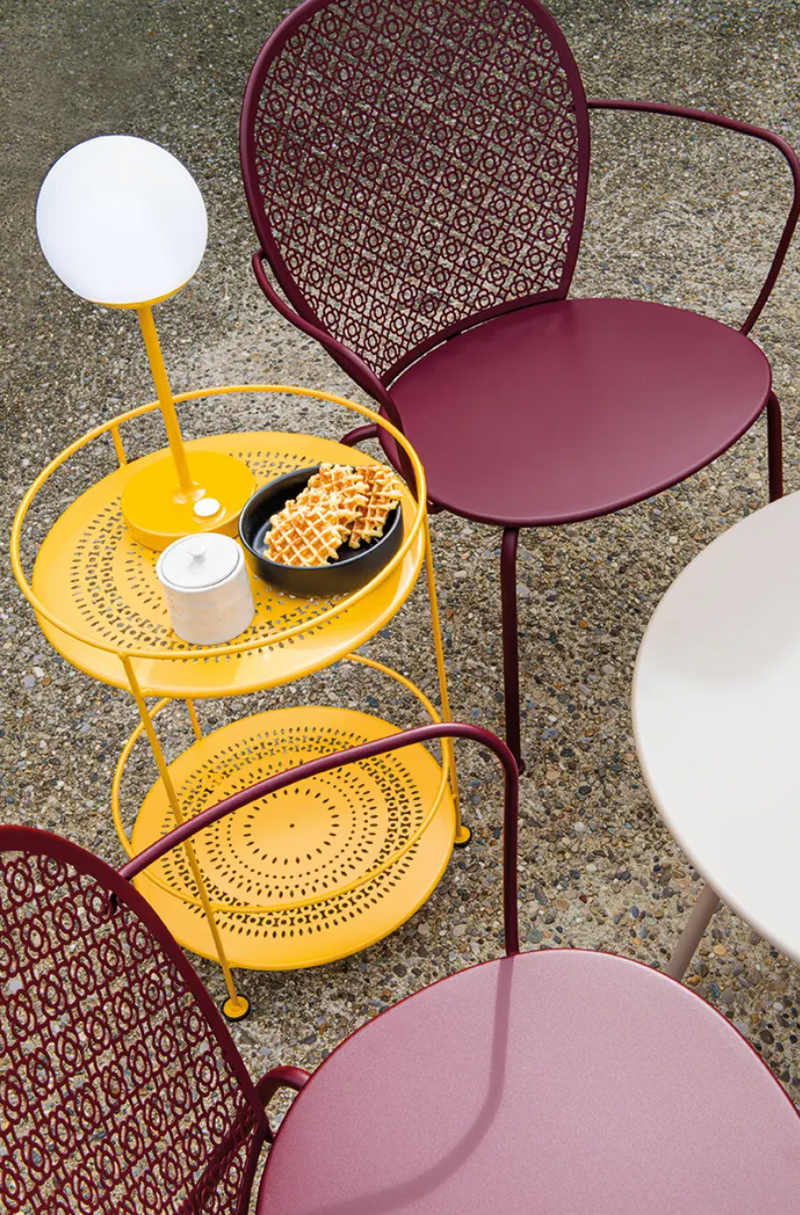 Load image into Gallery viewer, Fermob Guinguette side table with perforated double top, metal design, and modern outdoor furniture style.
