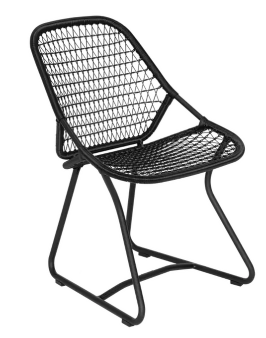 Fermob Sixties outdoor chair with sleek design for restaurant and hospitality settings, suitable for outdoor dining.