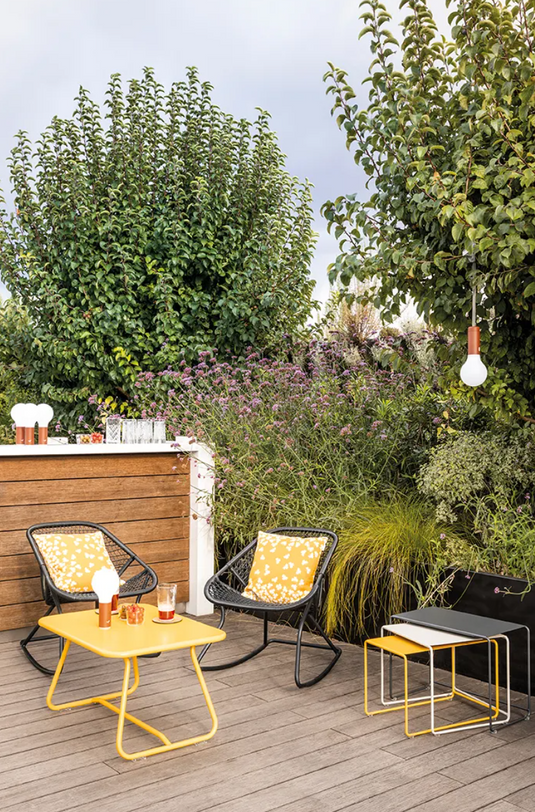 Outdoor metal Sixties rocking chair by Fermob, featuring a vintage-inspired design perfect for outdoor seating.