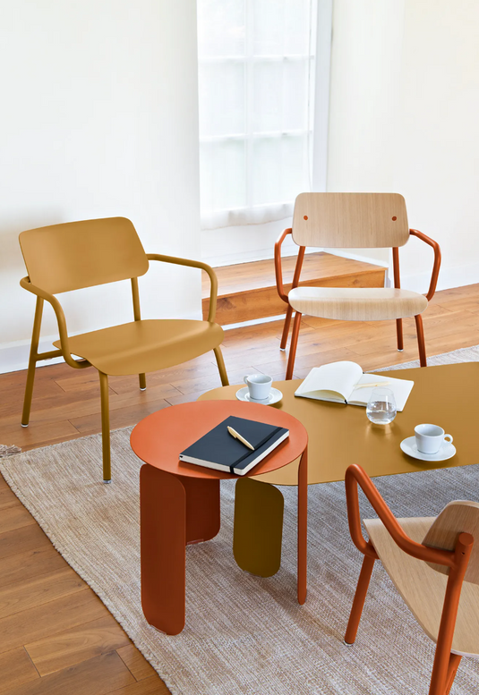 Stackable Fermob Studie Oak Lounge Armchair with metal frame and wooden seat, designed for modern office and lounge spaces.