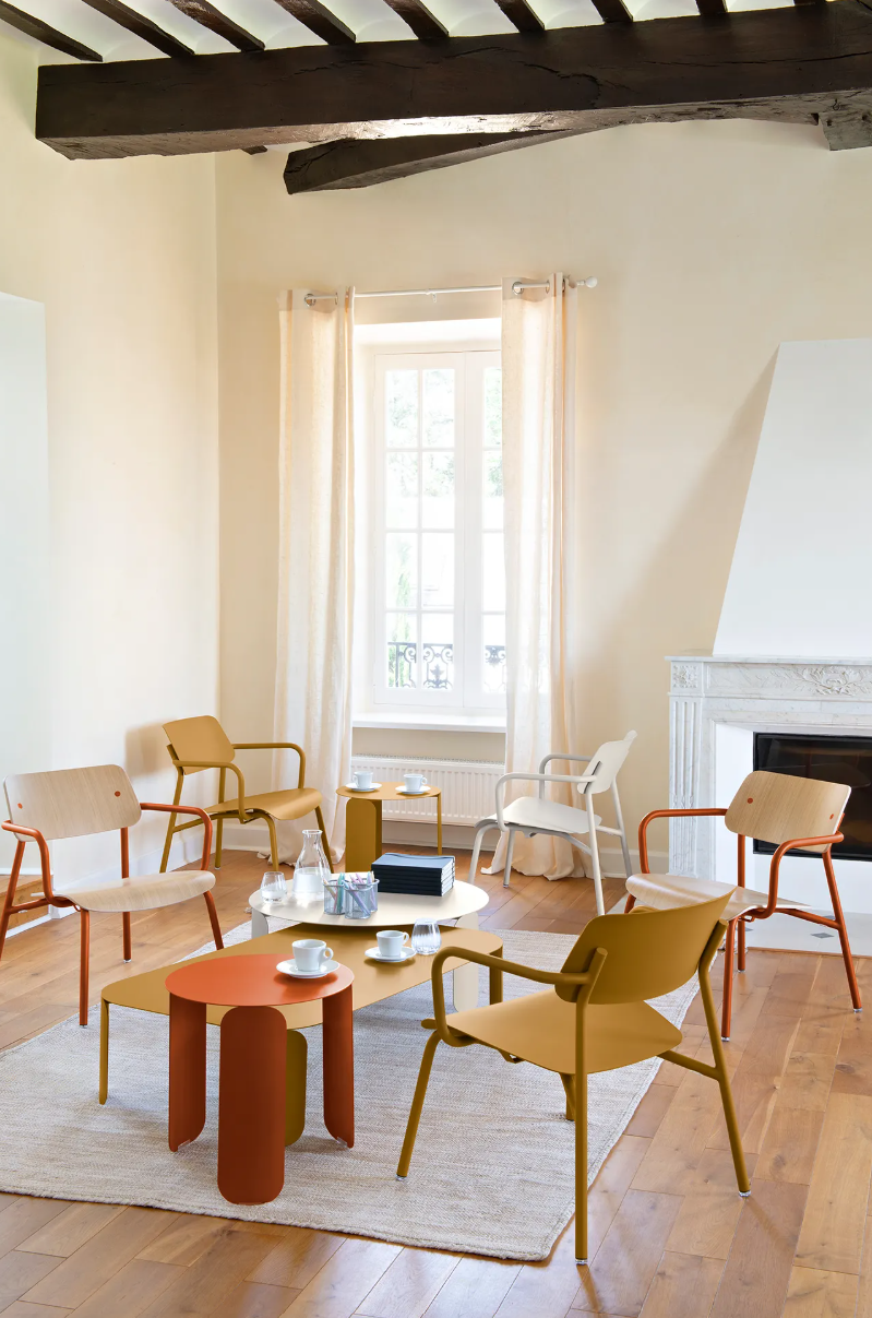 Load image into Gallery viewer, Stackable Fermob Studie Oak Lounge Armchair, a stylish metal chair with wooden accents, suitable for office or lounge settings.
