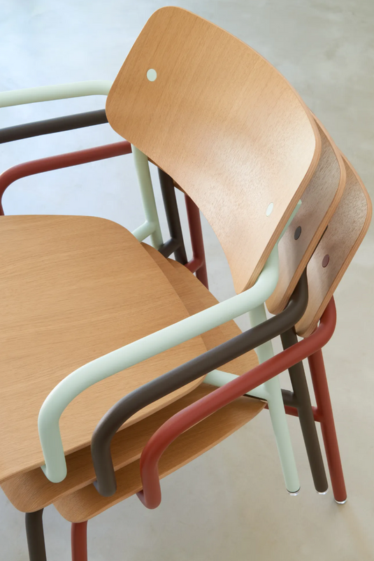 Stackable Fermob Studie Oak Lounge Armchair with a metal frame, featuring wooden armrests and a modern office furniture design.