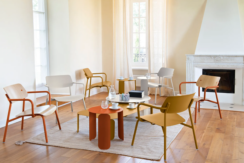 Load image into Gallery viewer, Stackable Fermob Studie Oak Lounge Armchair with metal frame, showcasing its elegant design and warm oak finish.
