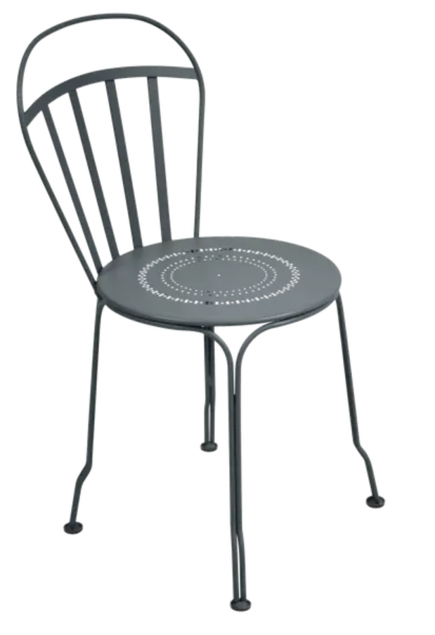 Load image into Gallery viewer, Storm grey Fermob Louvre outdoor chair with a sleek, modern design, featuring a curved seat and slender metal legs.
