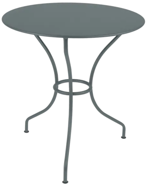 StormGrey Fermob OPÉRA+ outdoor metal table with 67cm diameter, suitable for patio or restaurant outdoor seating.