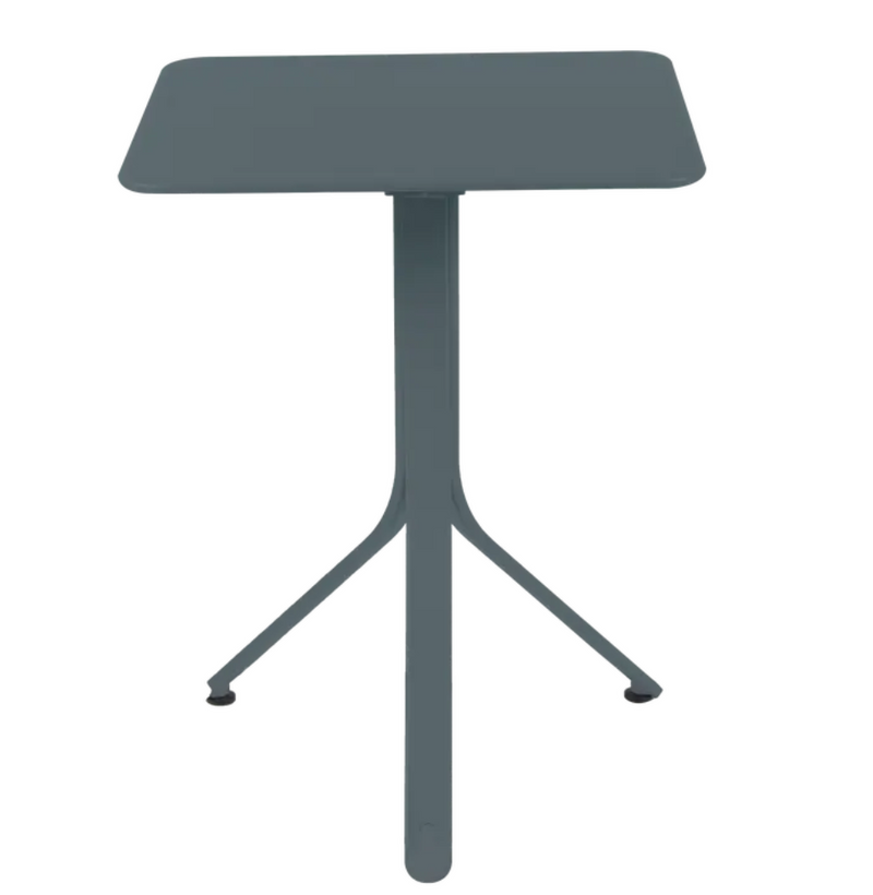 Load image into Gallery viewer, Storm Grey Fermob Rest'O folding outdoor table, 57x57cm, made of metal, perfect for outdoor use and compact storage.
