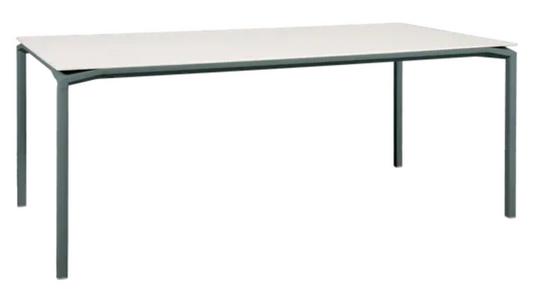 Fermob CALVI AERIS mineral dining table with eight seater capacity, featuring a sleek storm gray tabletop for indoor or outdoor use.