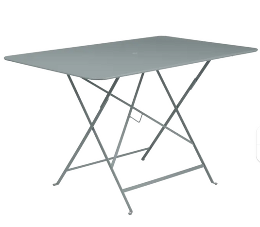 Storm grey Fermob foldable bistro table measuring 117x77 cm, outdoor metal table perfect for compact dining or outdoor spaces.