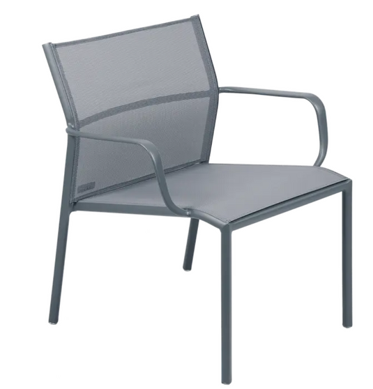 Storm grey Fermob Cadiz low armchair for outdoor use, featuring aluminum frame and technical fabric upholstery.