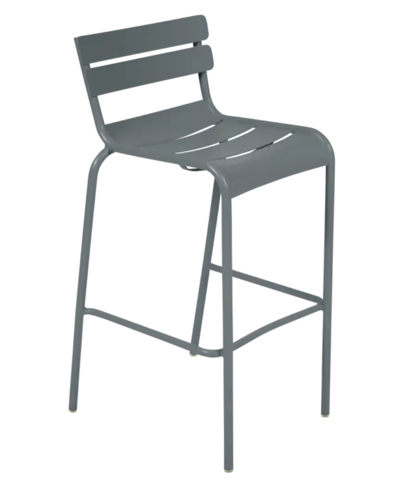 Load image into Gallery viewer, Storm grey Fermob Luxembourg bar armchair with metal frame, shown in a pub setting with a sleek, modern design.
