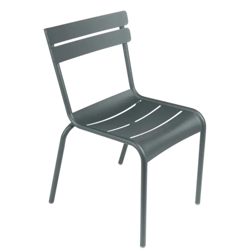 Load image into Gallery viewer, Storm grey Fermob Luxembourg armchair with a metal frame, stackable design, suitable for indoor and outdoor dining spaces.
