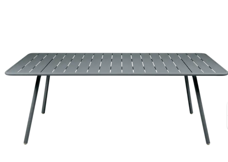 Load image into Gallery viewer, Storm grey Fermob Luxembourg outdoor table, 207x100 cm, made of durable weather-resistant material for outdoor dining and lounging.
