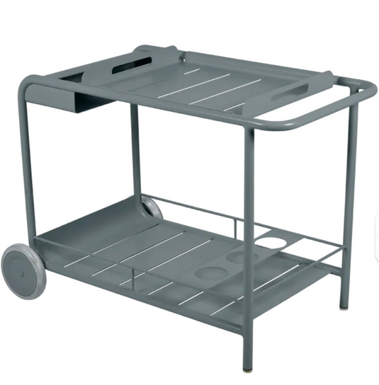 Storm grey Fermob Luxembourg Side Bar trolley with wheels, ideal for restaurant terrace drinks service and outdoor dining setups.