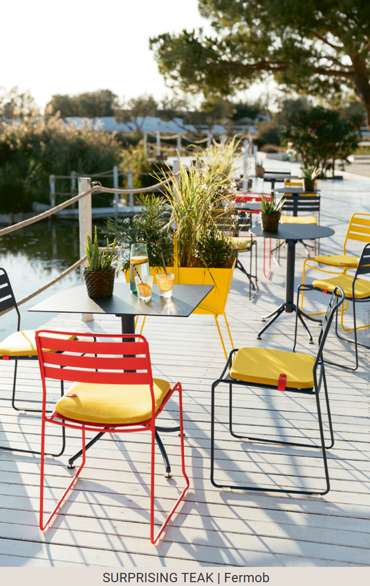 Fermob Surprising Teak Chair, outdoor metal chair with sleek design, suitable for patio or garden seating.