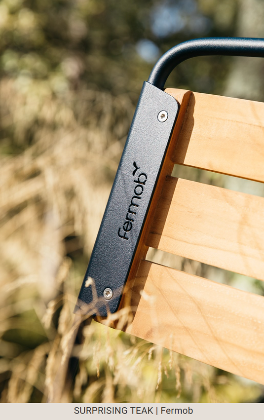 Fermob Surprising Teak Chair, outdoor metal chair with a modern design, featuring teak accents and a sturdy frame for outdoor use.