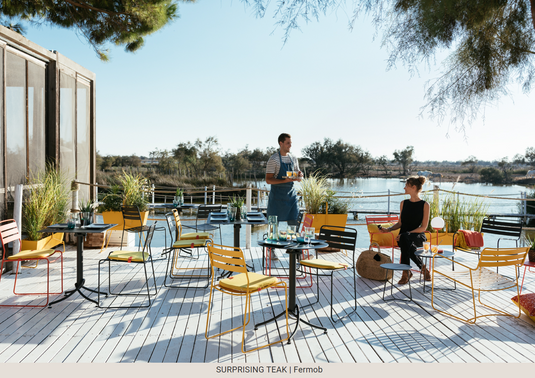 Fermob Surprising Teak Chair outdoor metal chair with teak accents, designed for stylish outdoor furniture use.