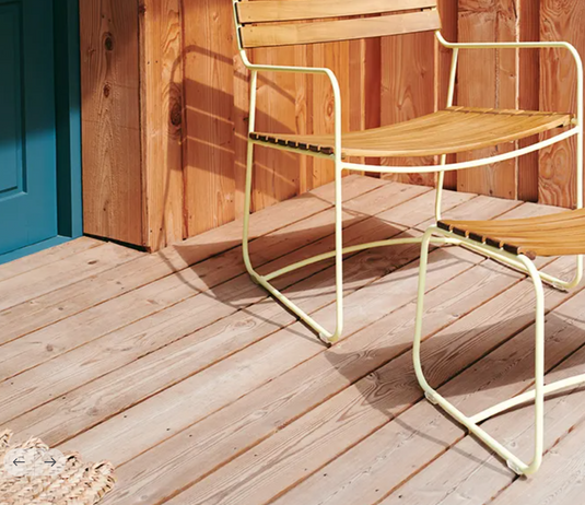 Fermob Surprising Teak Low Armchair outdoor metal chair with teak armrests and sleek design, suitable for patio or garden seating.