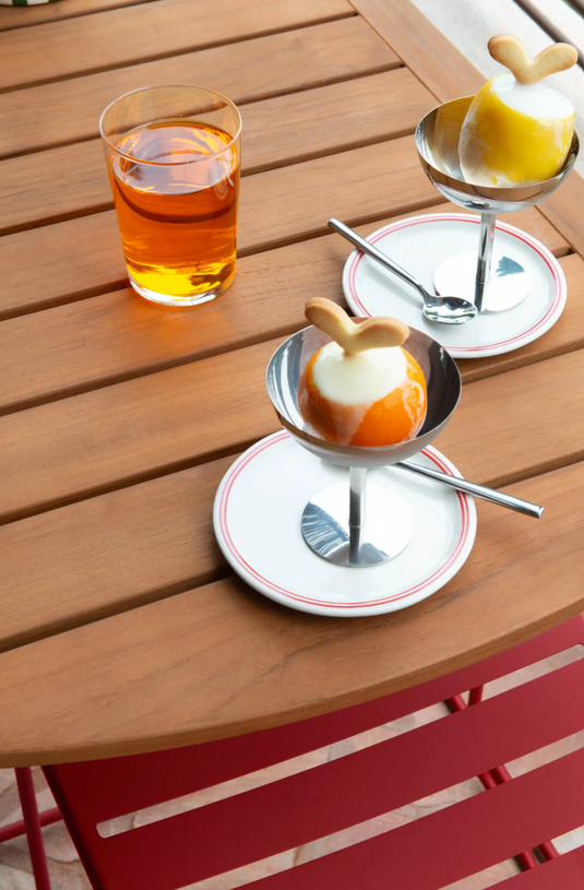 Fermob outdoor teak table measuring 90x60cm with sleek design and smooth finish, ideal for patio or garden outdoor dining.