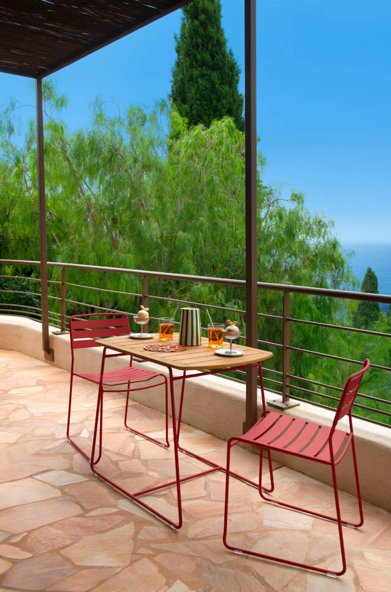 Load image into Gallery viewer, Fermob Surprising Teak Outdoor Table with 90x60cm dimensions, showcasing smooth teak surface and sturdy wooden legs.
