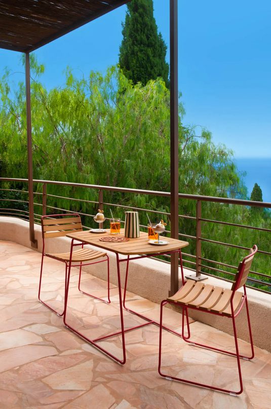 Fermob Surprising Teak Table with 90x60cm rectangular top, outdoor wooden table with sleek design and natural teak finish.