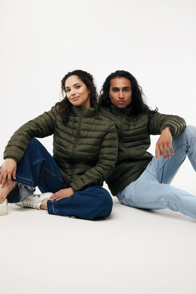 Load image into Gallery viewer, Recycled polyester padded jacket for women by iqoniq, showing a stylish textile jacket with a padded design and vibrant colors.
