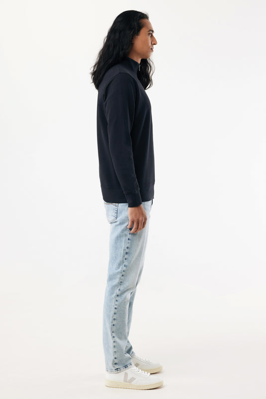 Iqoniq Elgon recycled cotton quarter zip sweater textile in a natural, eco-friendly fabric with a quarter zip neckline.