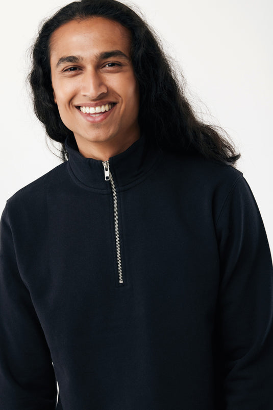 Iqoniq Elgon recycled cotton quarter zip sweater, close-up of the textile fabric in a natural setting.