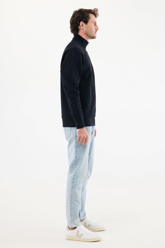 Load image into Gallery viewer, Iqoniq Elgon recycled cotton quarter zip sweater, textile product with a close-up of the fabric and quarter-zip neckline.
