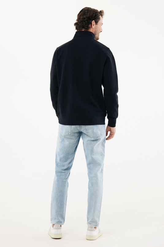 iqoniq Elgon recycled cotton quarter zip sweater, close-up of the textured textile fabric in natural colors.