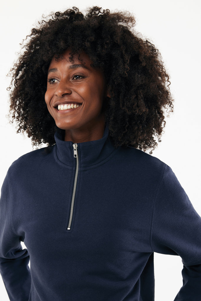 Load image into Gallery viewer, Iqoniq Elgon recycled cotton quarter zip sweater, close-up of soft fabric with quarter zipper and ribbed collar detail.
