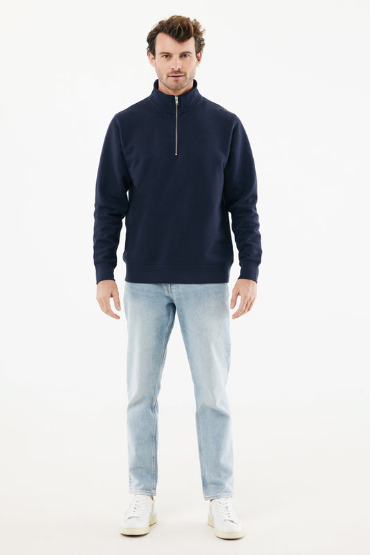 Iqoniq Elgon recycled cotton quarter zip sweater, close-up of the textile fabric showcasing its soft, sustainable material and design.