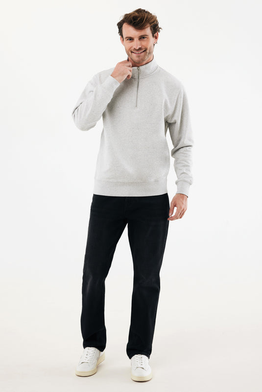 Iqoniq Elgon recycled cotton quarter zip sweater, close-up of navy textile with zipper detail and textured fabric.