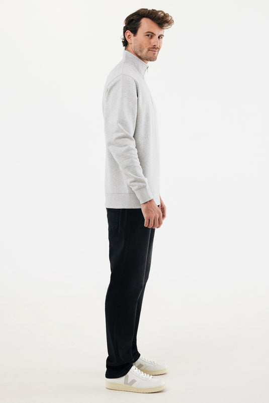 Iqoniq Elgon recycled cotton quarter zip sweater, close-up of the textile showcasing the soft fabric and quarter zip design.