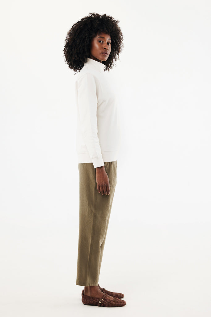 Load image into Gallery viewer, Iqoniq Elgon recycled cotton quarter zip sweater, close-up of soft textile fabric in natural color with zipper detail.
