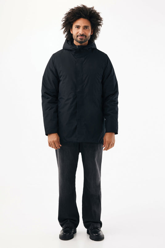 Recycled polyester Thelon parka by iqoniq, showcasing a sleek outdoor textile with a hood and front zipper.