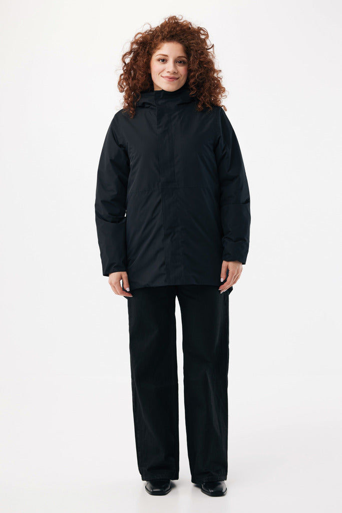 Load image into Gallery viewer, Iqoniq Thelon recycled polyester parka in textile fabric, shown with a front view and adjustable hood.
