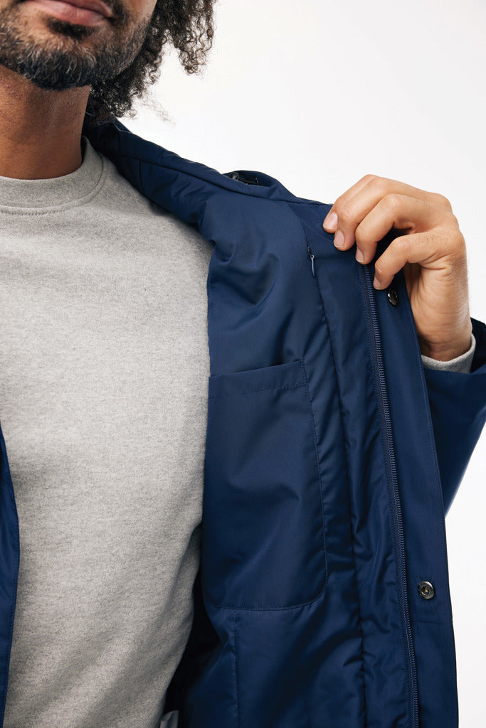 Load image into Gallery viewer, Thelon recycled polyester parka by iqoniq, featuring a textile design with a hood and front zipper for outdoor wear.
