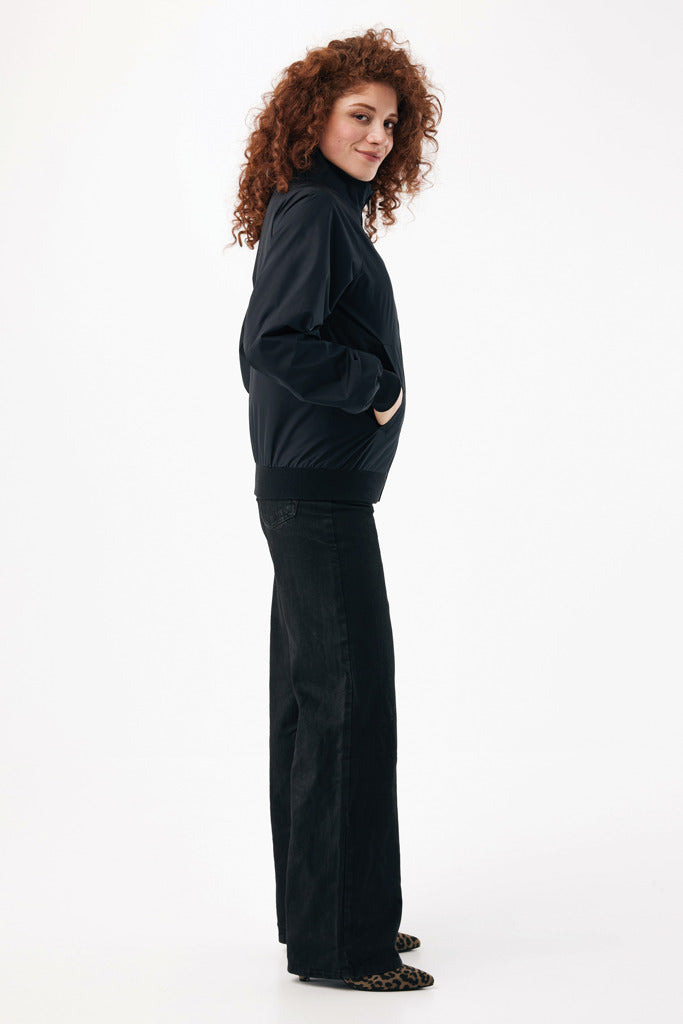 Load image into Gallery viewer, Iqoniq Odin recycled polyester urban jacket textile in black, featuring a modern design and sleek fit, suitable for city wear.
