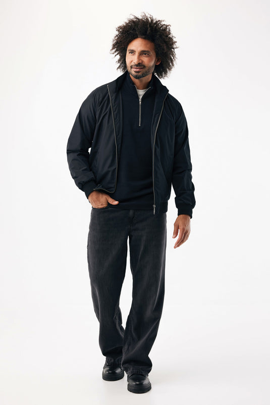 Iqoniq Odin recycled polyester urban jacket displayed flat, showcasing its textile material and modern design.