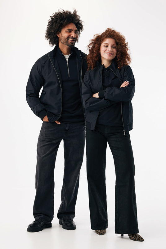 iqoniq Odin recycled polyester urban jacket in textile, shown in black with a zip front and hood, casual streetwear style.