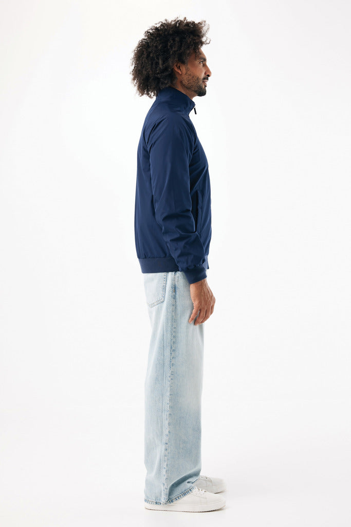 Load image into Gallery viewer, iqoniq Odin recycled polyester urban jacket, textile, shown in a close-up view highlighting fabric texture and design details.

