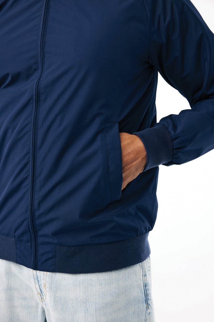Load image into Gallery viewer, Iqoniq Odin recycled polyester urban jacket displayed on a textile mannequin, showcasing the stylish design and eco-friendly fabric.
