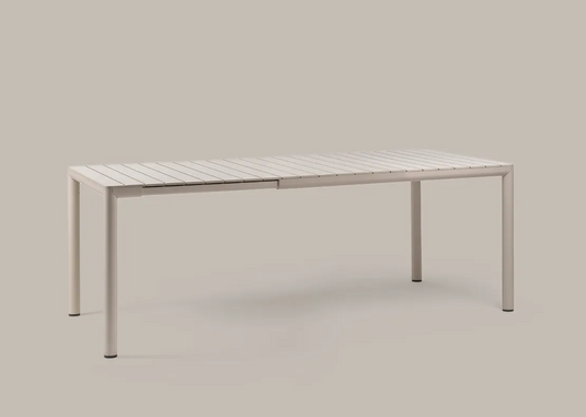 Nardi Tevere 147 Extensible outdoor table by Custom Wood Designs, showing a sturdy wooden table with extended leaves in a garden setting.