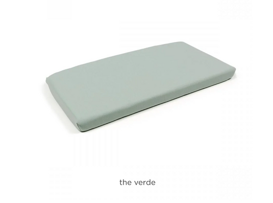 Nardi Net Bench Cushion on sofa, outdoor patio furniture, soft fabric with vibrant green pattern for comfortable seating.