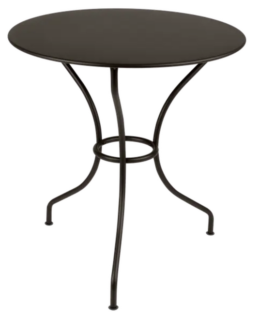 Fermob OPÉRA+ outdoor metal table with 67 cm diameter, suitable for patio or restaurant setting, shown on a patio surface