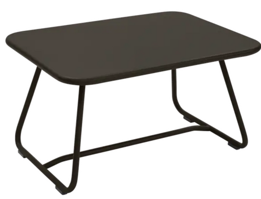 Fermob Sixties low outdoor table, 76x55.5cm, with a sleek design and smooth surface, ideal for patio or garden use.